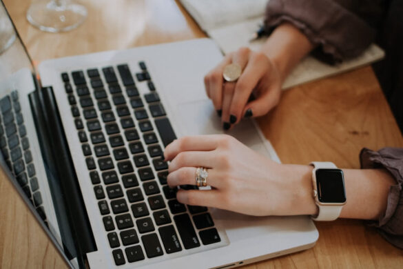 A person typing on a laptop, exploring top enterprise AI platforms for business solutions.